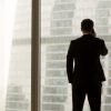 CEO standing at the window on the phone