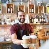 coffee shop owner serving drinks