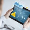 medical app business plan - man on tablet