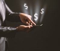 app funding - money signs coming from smartphone