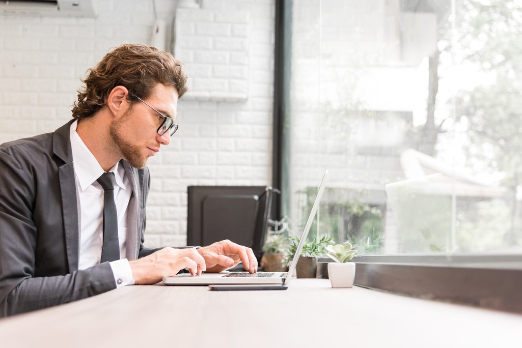 Chief Financial Officer - CFO typing on laptop.